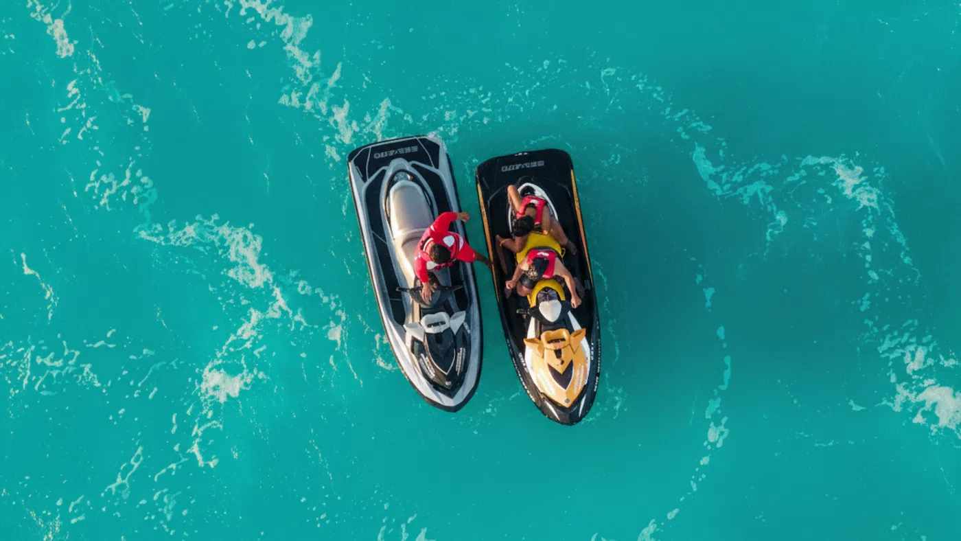 Cancun jetski rental instructor giving assistance to jetski driver